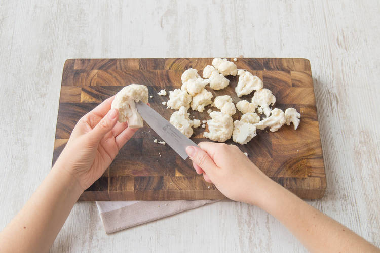 Cut the cauliflower into florets