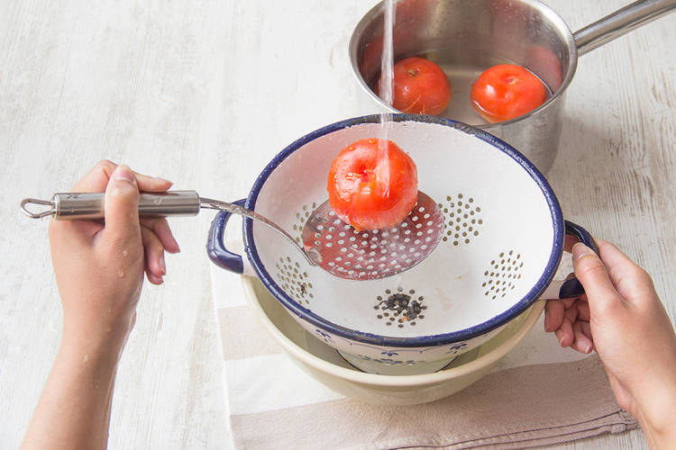 Remove tomatoes after 60 seconds and run under cold water