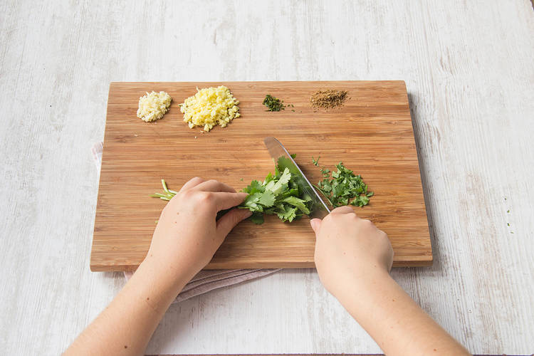 Roughly chop coriander