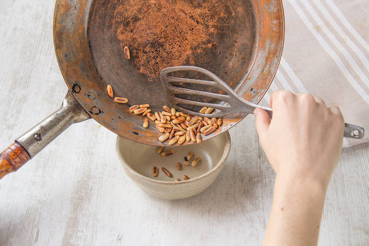 Toast pine nuts and remove