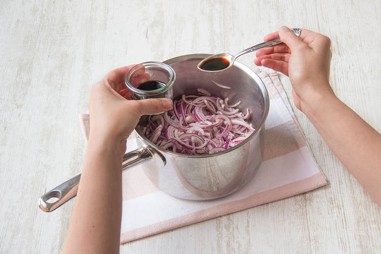 Add balsamic vinegar to onion