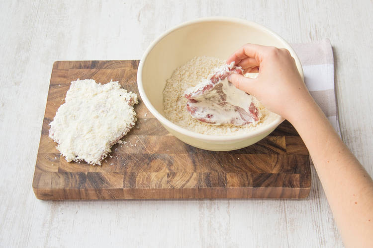 Coat pork in breadcrumbs
