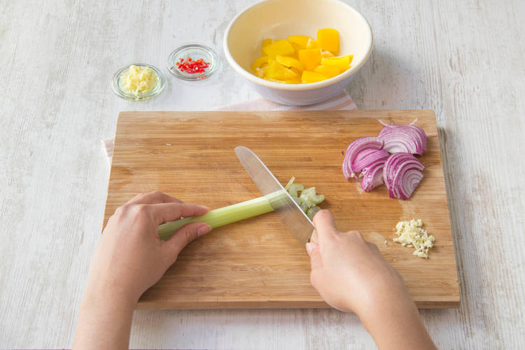 Thinly slice celery