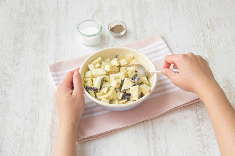 Toss aubergine in cornflour