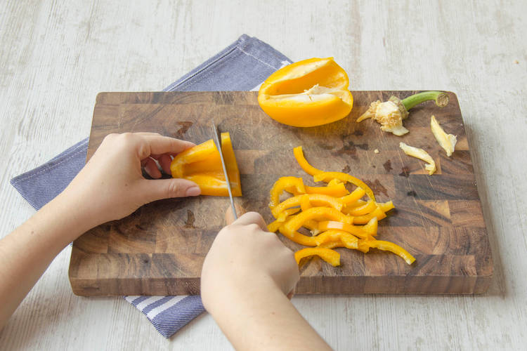 Slice pepper into strips