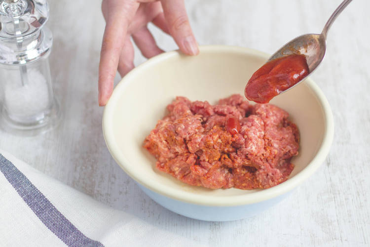 Putting ketchup in bowl