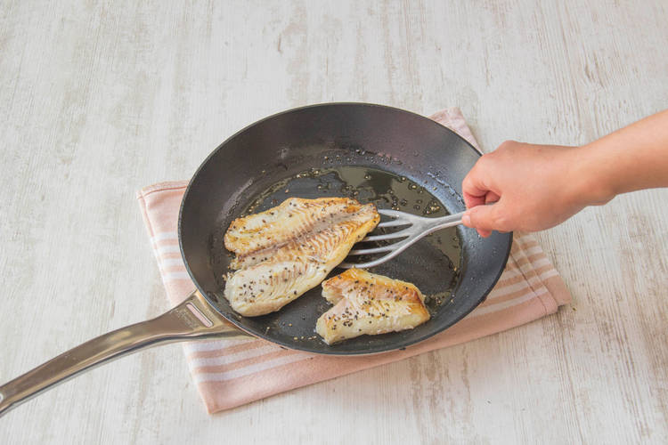 Fry tilapia on one side