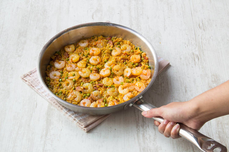 top the rice with shrimp
