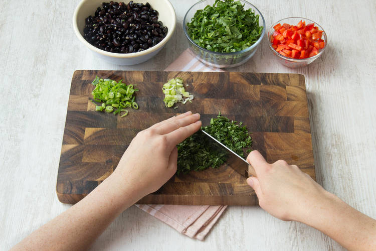 Roughly chop coriander