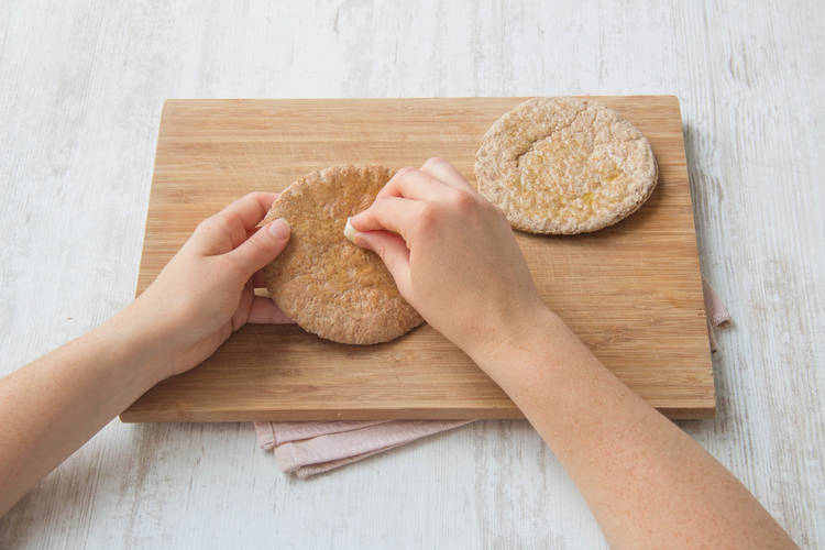 Rub your garlic clove over the pita