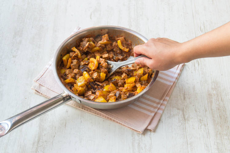 Add the aubergine and caulflower to the pan along with the paneer