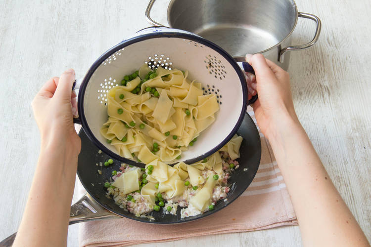 Add the pasta and peas to pan