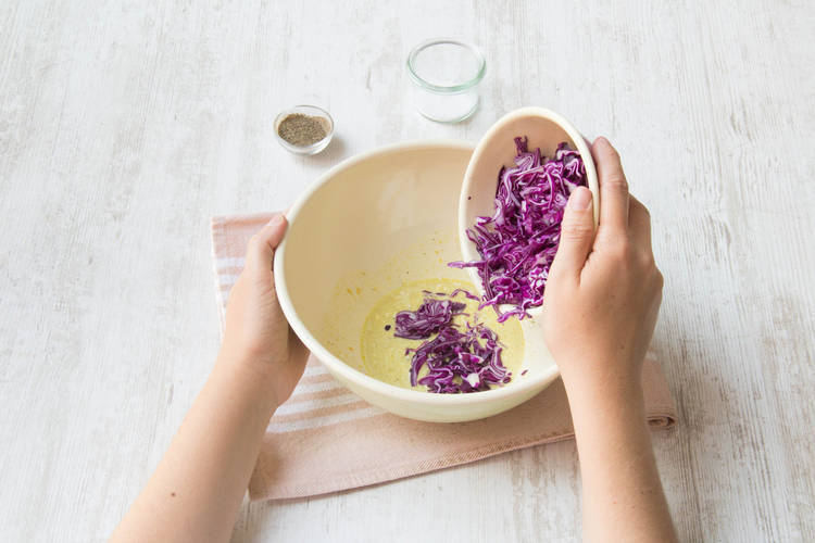 Add the cabbage to the dressing