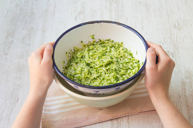 Grate courgettes
