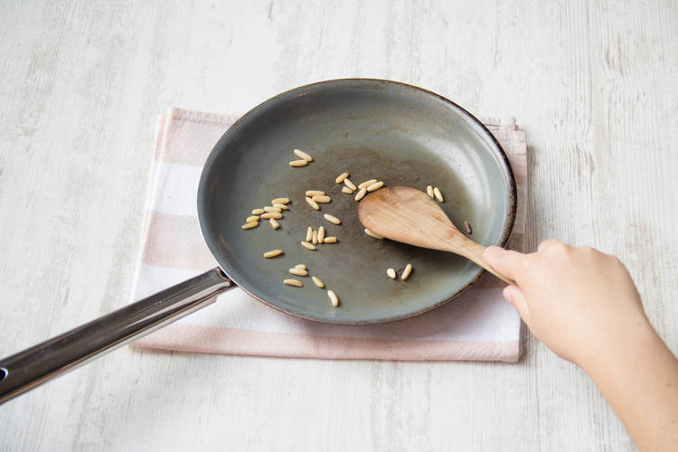 Toast the pine nuts