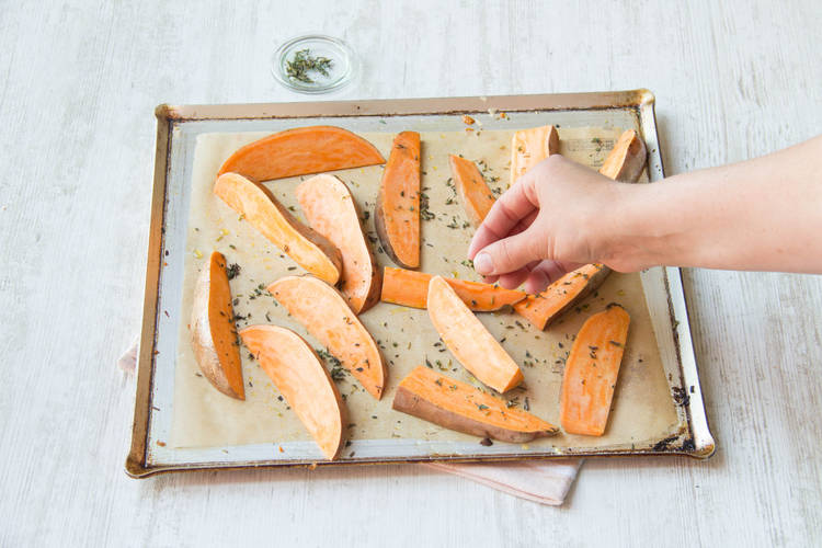 Arrange your sweet potatoes in a single layer on your baking tray