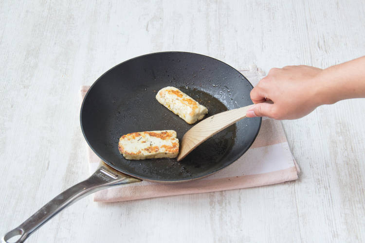 Fry halloumi until blistered