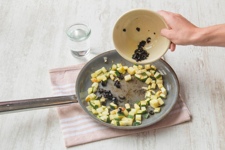 Add the olives back into the pan