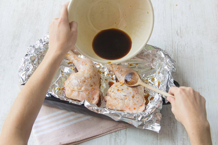 Pour marinade over chicken