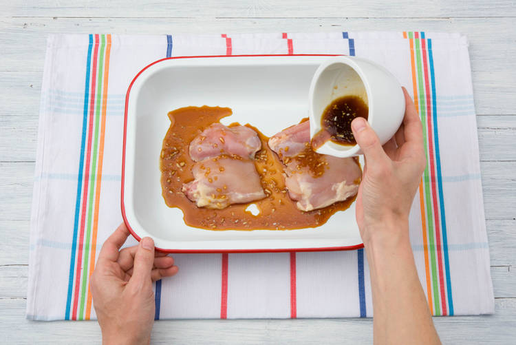 Pour the marinade over the chicken thighs