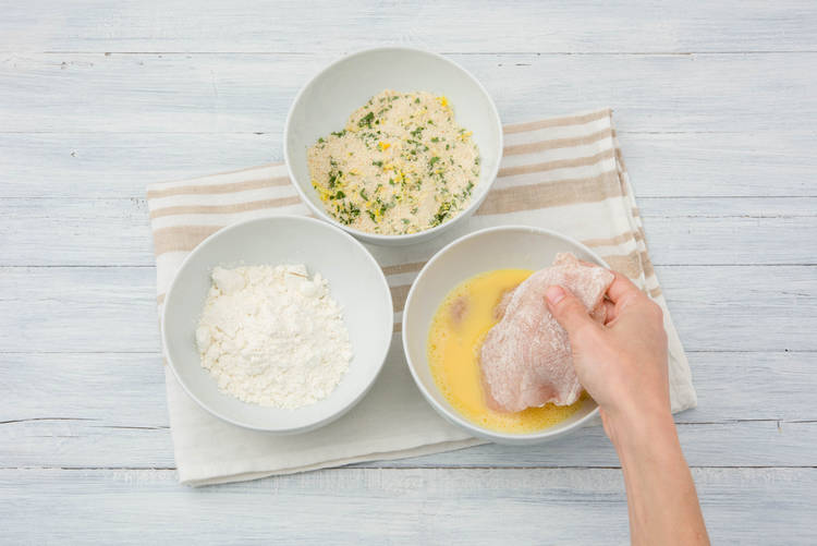 Dip the chicken breast into the egg