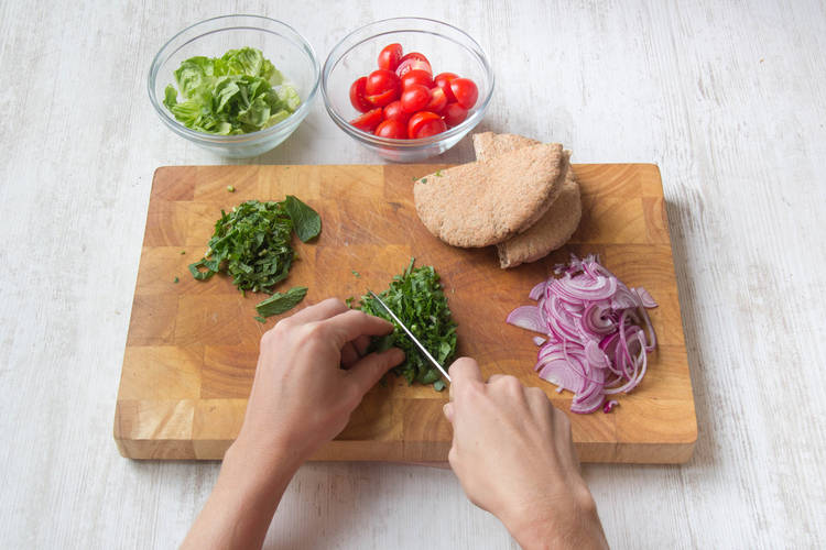 Prepare veggies, pita and herbs