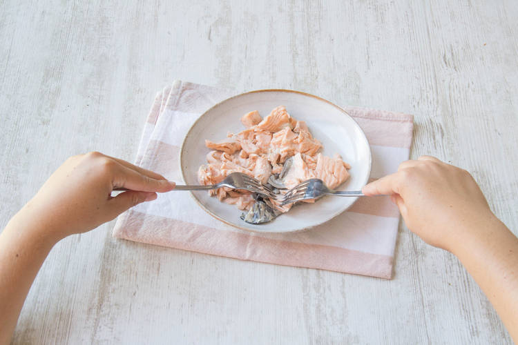 Pull the fish flakes apart