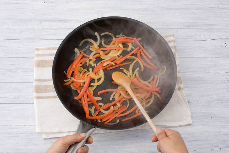 Cook the onions and peppers