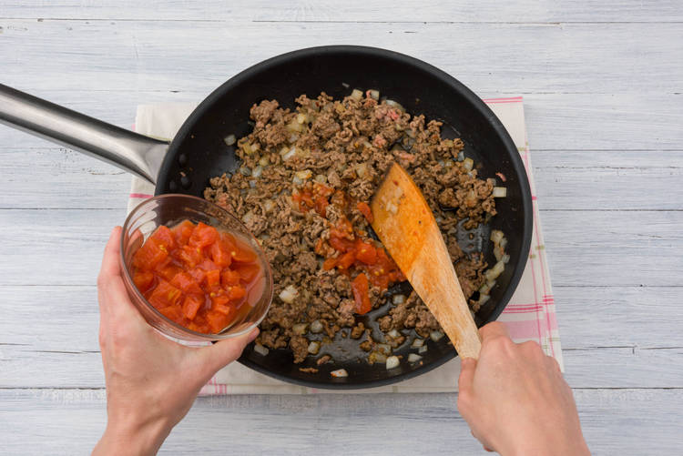 Add tomato to mince