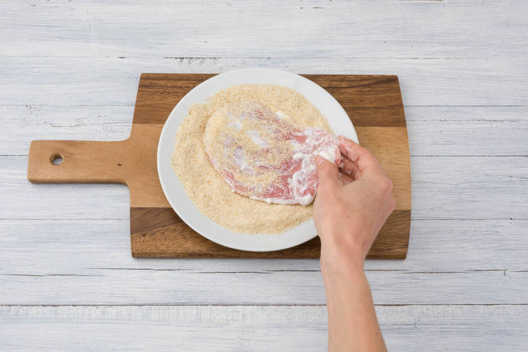 Coat pork in breadcrumbs
