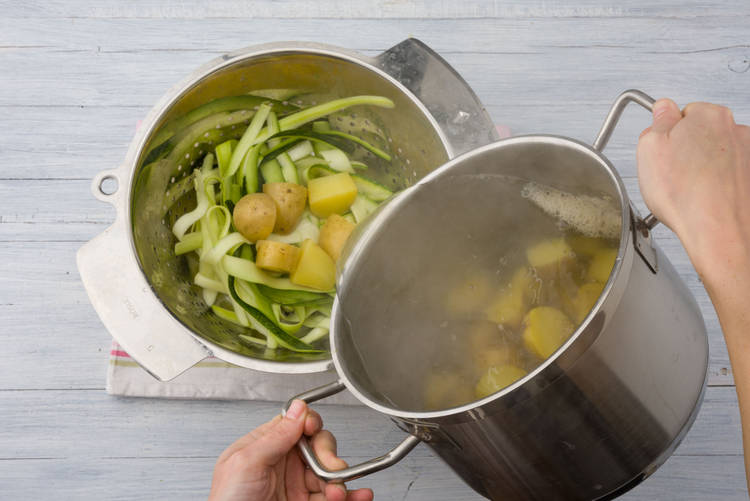 Drain the potatoes over the zucchini