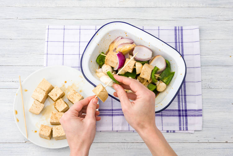 Thread veggies and tofu onto skewers