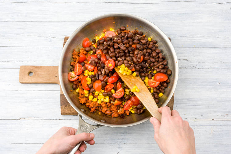 Add the beans, corn and tomatoes