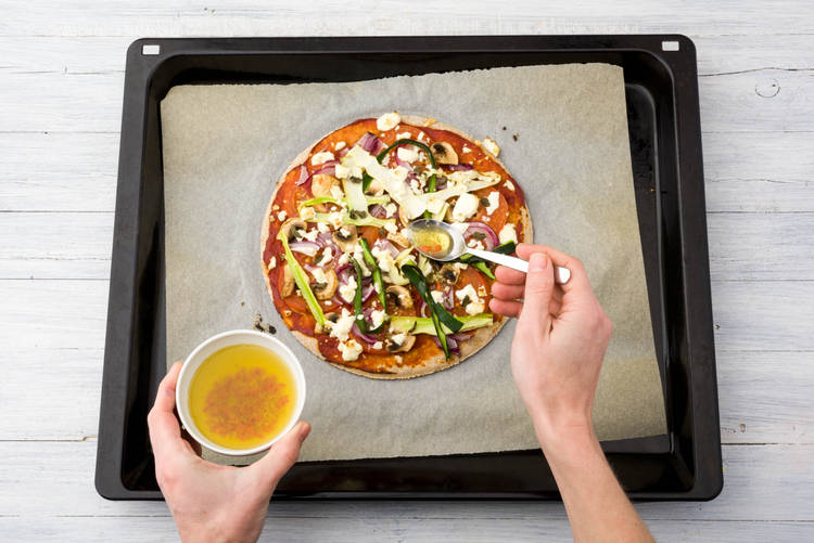 Drizzle the pizza