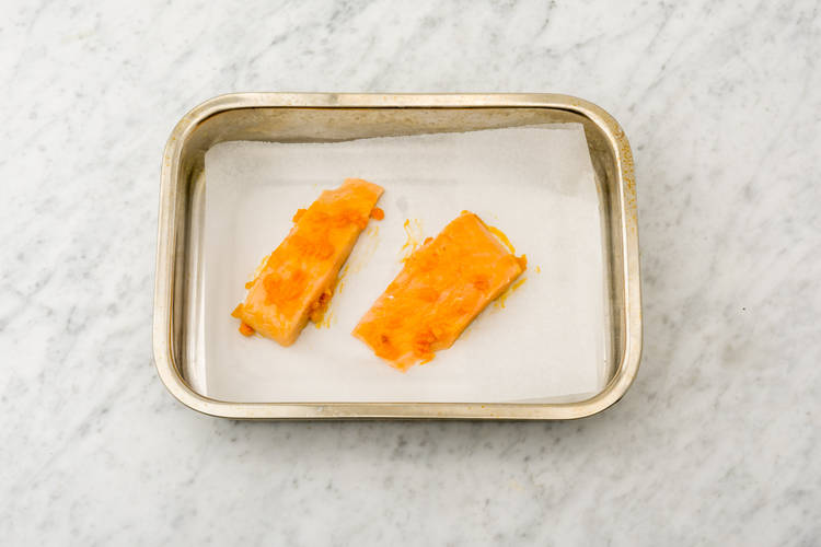 Coat your salmon fillets in the chutney mixture and pop them on a baking tray