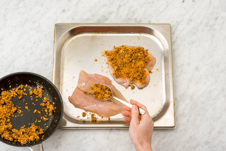 Pile the chorizo crust onto each chicken breast
