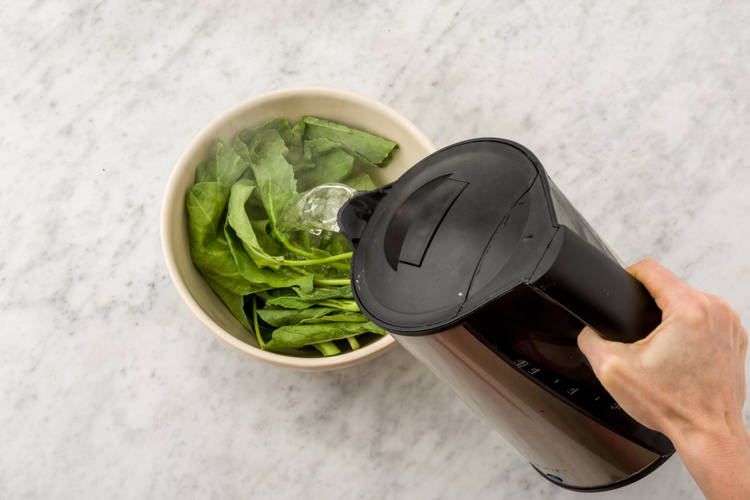 Cover the Asian greens with boiling water