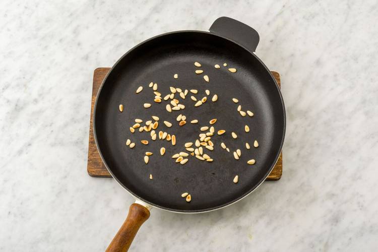 Toast the pine nuts