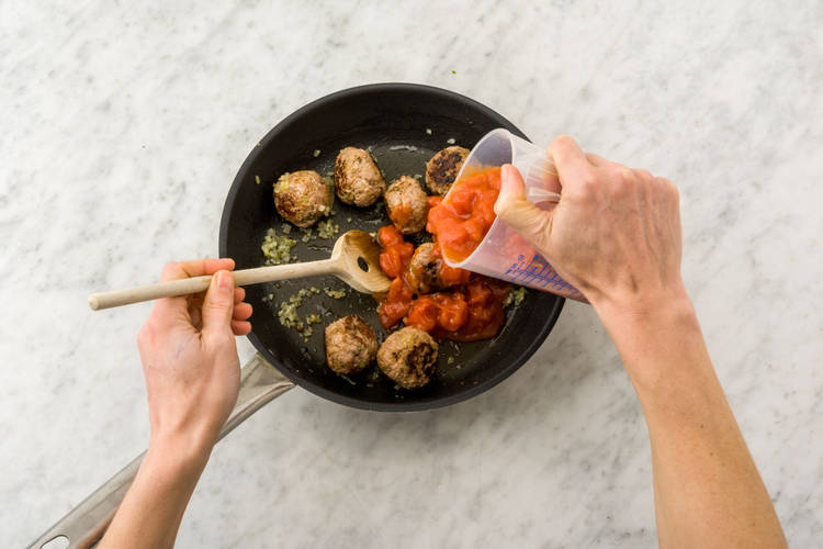 Return meatballs to the pan and cook sauce