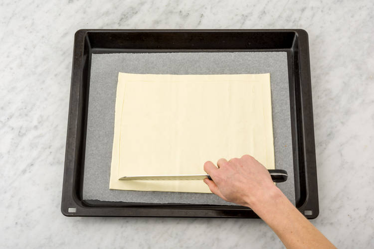 Mark a border round the pastry