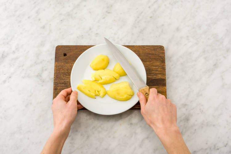 Smash potatoes using a chef's knife