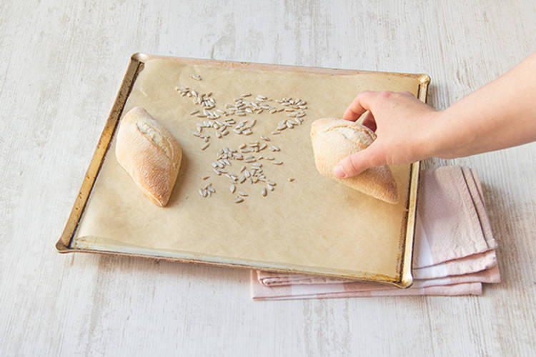 Heat the bread rolls and sunflower seeds