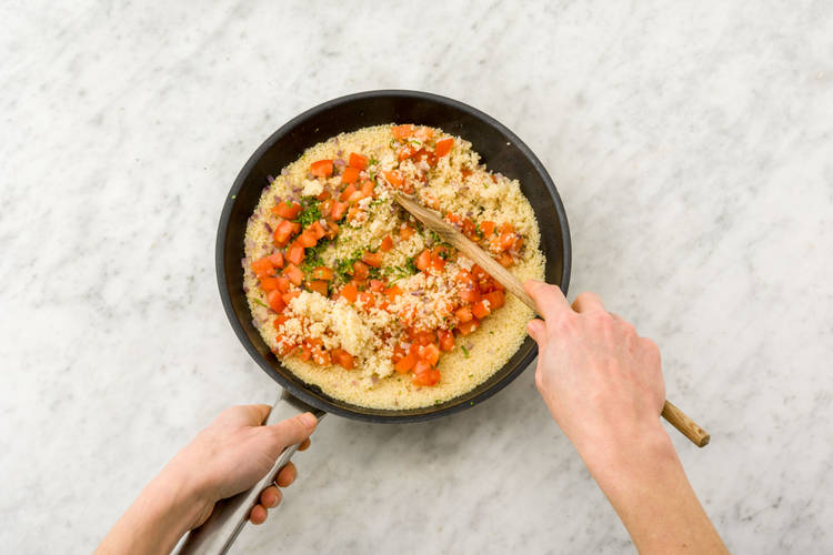 Stir the tomatoes and mint into the couscous