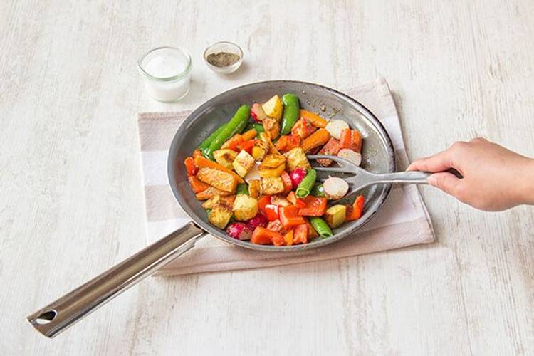 Toss the salad and plate