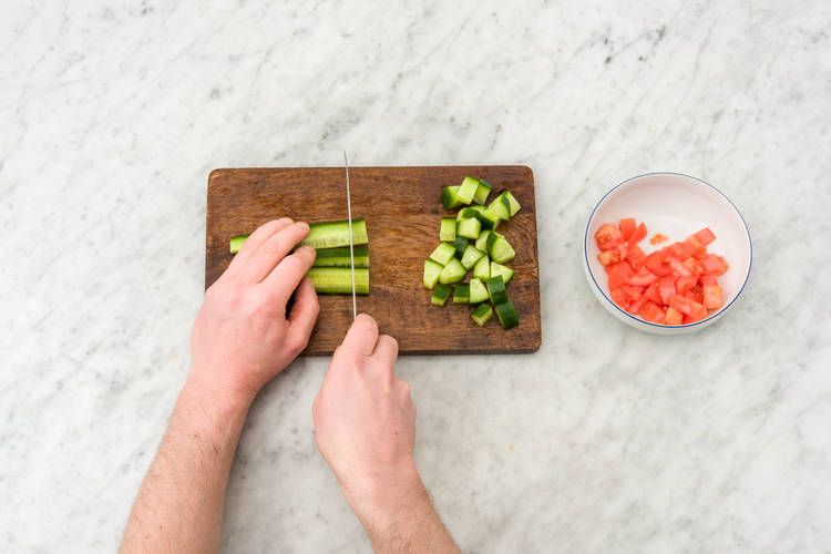 Dice the cucumber and tomato