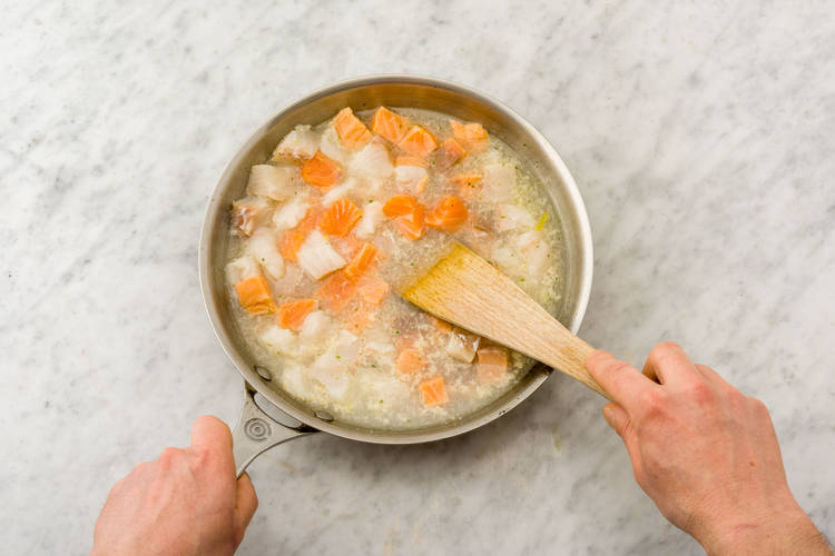 Simmer the stock and seafood