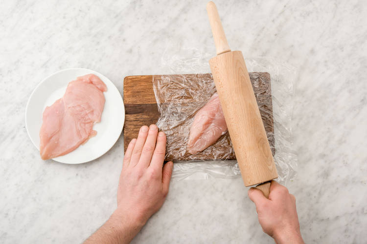 Flatten the chicken breasts