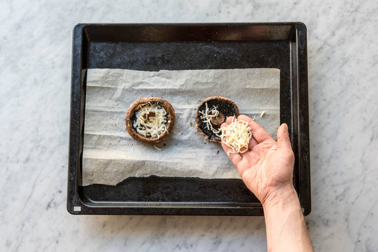 Top mushrooms with cheese