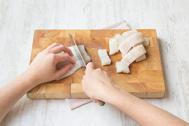 Slice fish into strips
