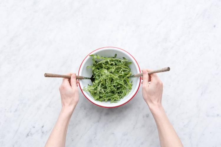 Dress the arugula salad